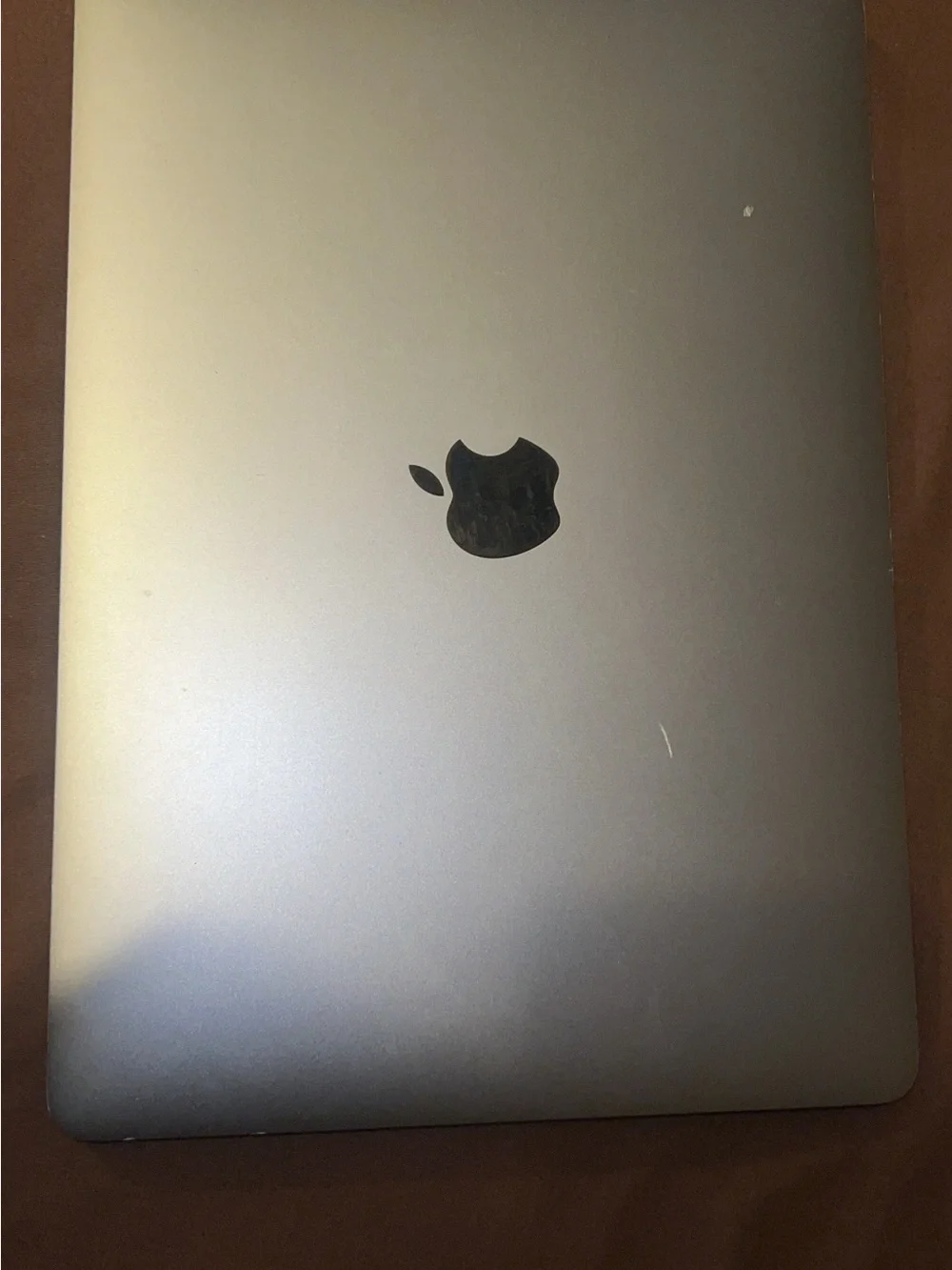 Apple MacBook Laptop in Silver with Black Apple Logo